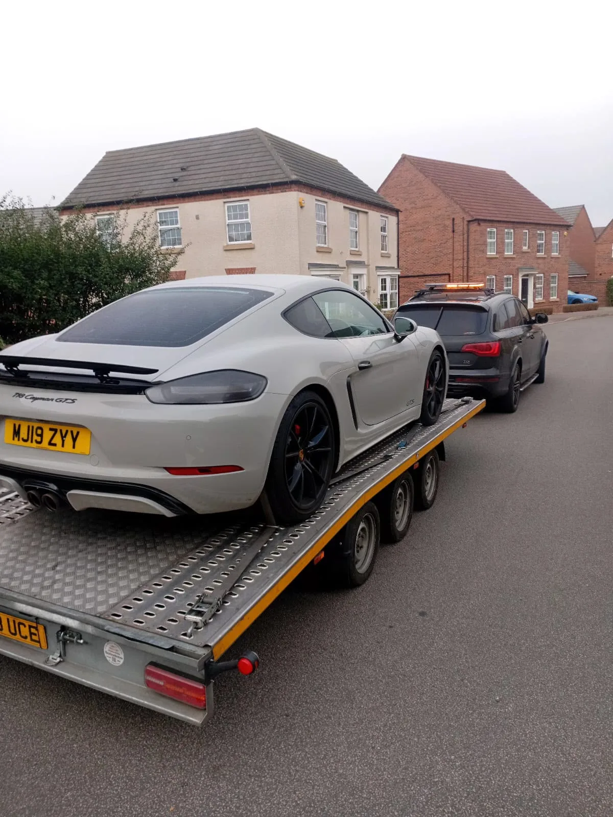 Porsche Cayman GTS secured on a KYS Recovery trailer
